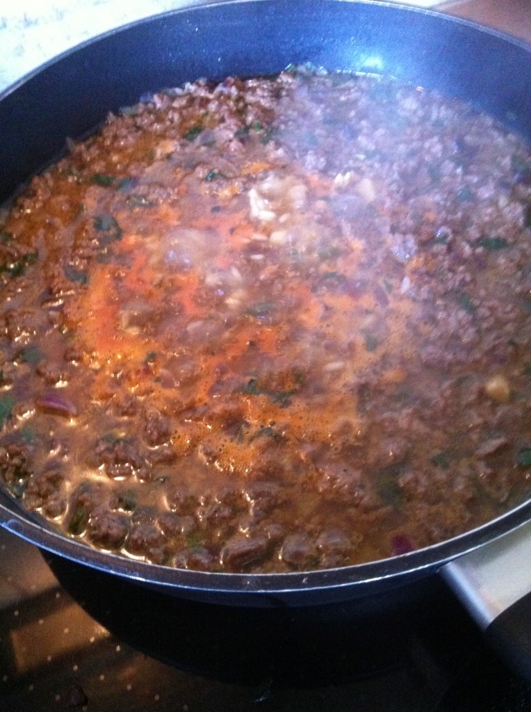 beef and rice cooking